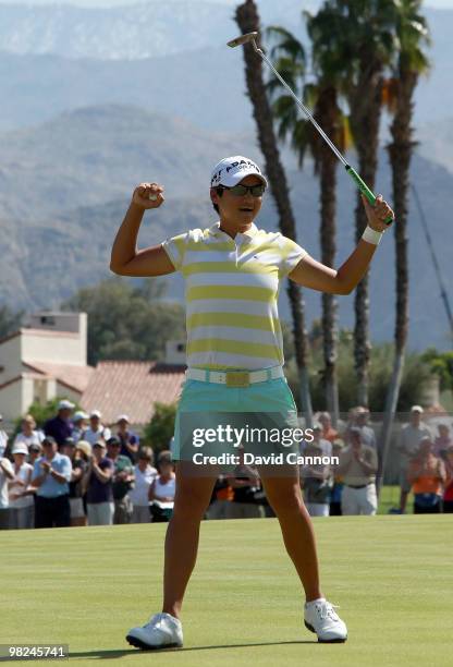 Yani Tseng of Taiwan celebrates after holing the winning putt on the 18th green during the final round of the 2010 Kraft Nabisco Championship, on the...