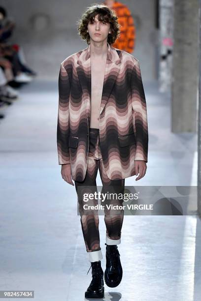 Model walks the runway during the Dries Van Noten Menswear Spring/Summer 2019 fashion show as part of Paris Fashion Week on June 21, 2018 in Paris,...