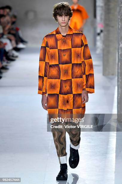 Model walks the runway during the Dries Van Noten Menswear Spring/Summer 2019 fashion show as part of Paris Fashion Week on June 21, 2018 in Paris,...