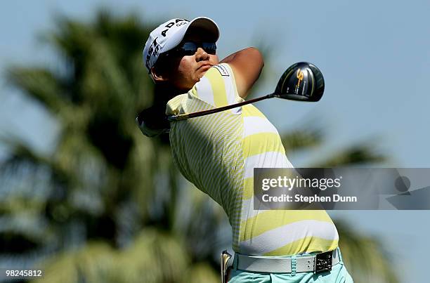 Yani Tseng of Taiwan hits her tee shot on the 11th hole during the final round of the Kraft Nabisco Championship at Mission Hills Country Club on...