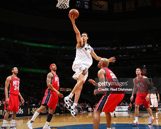 JaVale McGee of the Washington Wizards shoots against Jarvis Hayes of the New Jersey Nets at the Verizon Center on April 4, 2010 in Washington, DC....