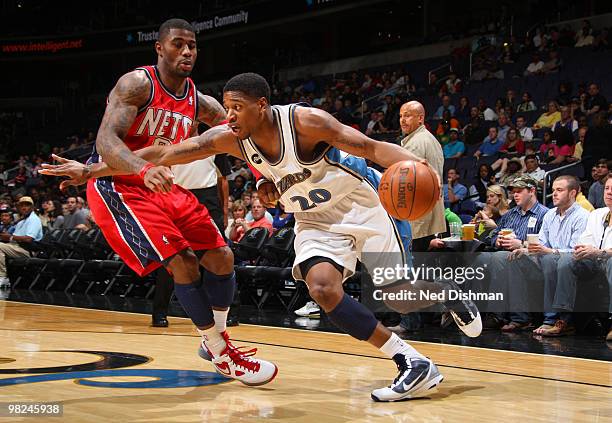 Cartier Martin of the Washington Wizards drives against Terrence Williams of the New Jersey Nets at the Verizon Center on April 4, 2010 in...