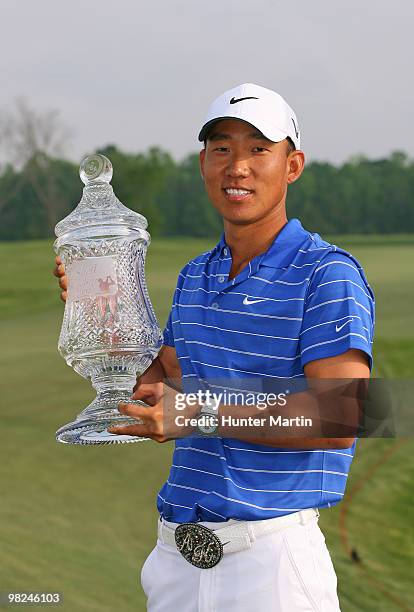 Anthony Kim holds the championship trophy after winning the Shell Houston Open at Redstone Golf Club on April 4, 2010 in Humble, Texas.