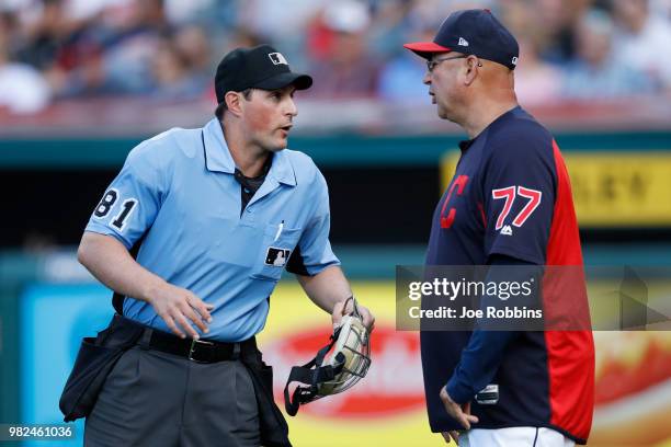 Cleveland Indians manager Terry Francona talks to home plate umpire Quinn Wolcott in the sixth inning against the Detroit Tigers at Progressive Field...