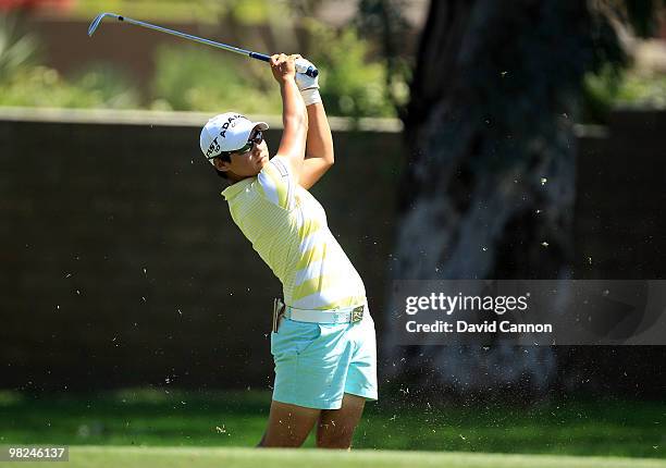 Yani Tseng of Taiwan plays her second shot at the 15th hole during the final round of the 2010 Kraft Nabisco Championship, on the Dinah Shore Course...