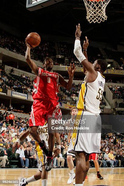 Aaron Brrooks of the Houston Rockets shoots over Roy Hibbert of the Indiana Pacers at Conseco Fieldhouse on April 4, 2010 in Indianapolis, Indiana....