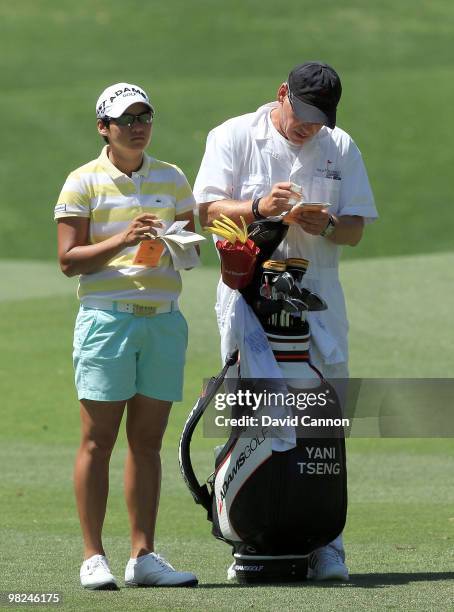 Yani Tseng of Taiwan prepares to play her second shot at the 12th hole during the final round of the 2010 Kraft Nabisco Championship, on the Dinah...