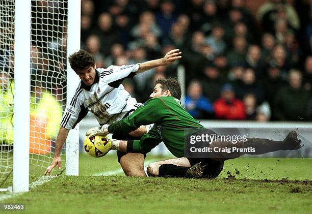 Karl Heinz Riedle of Fulham challenges Simon Tracey of Sheffield United on the goal line during the Nationwide Division One match between Fulham and...