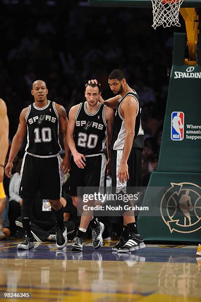 Keith Bogans, Manu Ginobili, and Tim Duncan of the San Antonio Spurs come together during a game against the Los Angeles Lakers at Staples Center on...