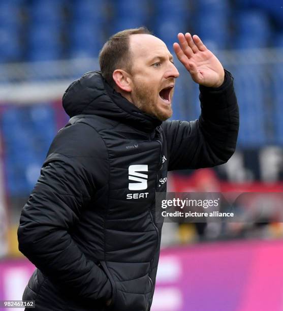 Braunschweig coach Torsten Lieberknecht follows the German Second Bundesliga football match between Eintracht Braunschweig and 1. FC Kaiserslautern...