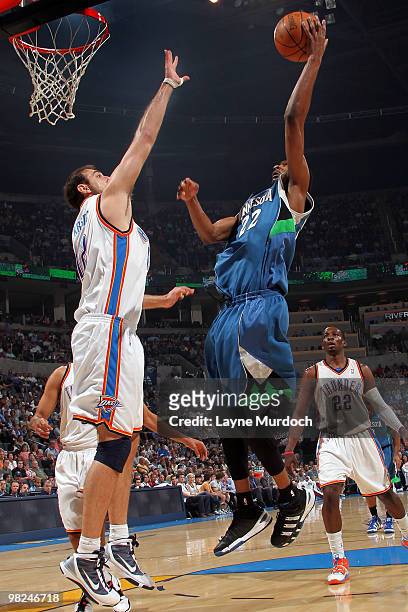 Corey Brewer of the Minnesota Timberwolves shoost the ball over Nenad Krstic of the Oklahoma City Thunder on April 4, 2010 at the Ford Center in...