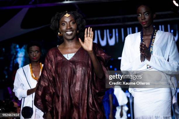 Designer Adama Paris greets the crowd after her show at the 16th Dakar Fashion Week at Radison Blu Hotel on June 23, 2018 in Dakar, Senegal.