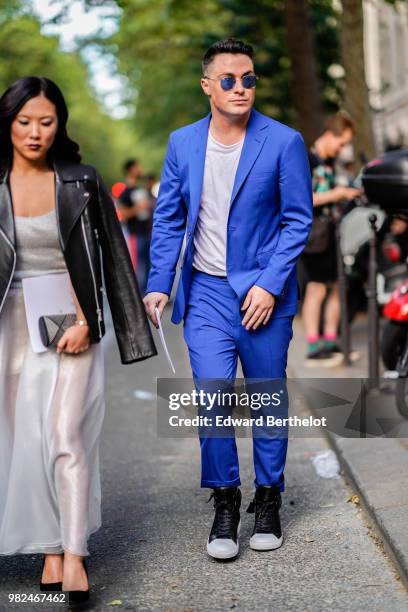 Colton Haynes wears a blue blazer jacket, a blue suit, blue pants, outside Dior, during Paris Fashion Week - Menswear Spring-Summer 2019, on June 23,...