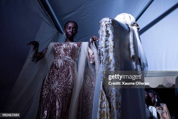 Models get ready during day three of the 16th Dakar Fashion Week at Radison Blu Hotel on June 23, 2018 in Dakar, Senegal.