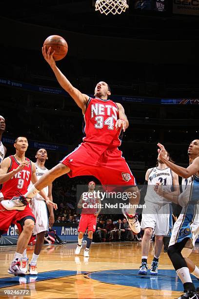 Devin Harris of the New Jersey Nets shoots against Shaun Livingston of the Washington Wizards at the Verizon Center on April 4, 2010 in Washington,...