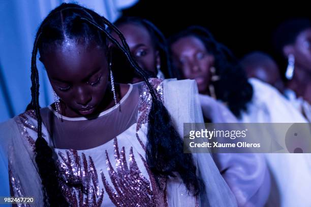 Models get ready during day three of the 16th Dakar Fashion Week at Radison Blu Hotel on June 23, 2018 in Dakar, Senegal.