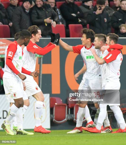 Augsburg's Kevin Danso, Michael Gregoritsch, Ja-Cheol Koo, Daniel Baier and Marcel Heller celebrate in Augsburg, Germany, 4 February 2018. Photo:...