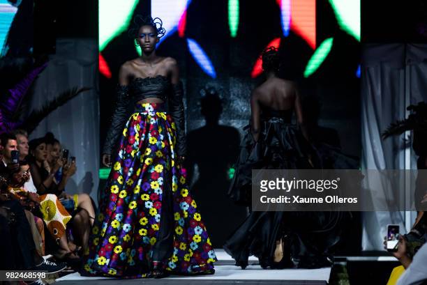 Models walk the runway during the Quiteria X George show at the 16th Dakar Fashion Week at Radison Blu Hotel on June 23, 2018 in Dakar, Senegal.