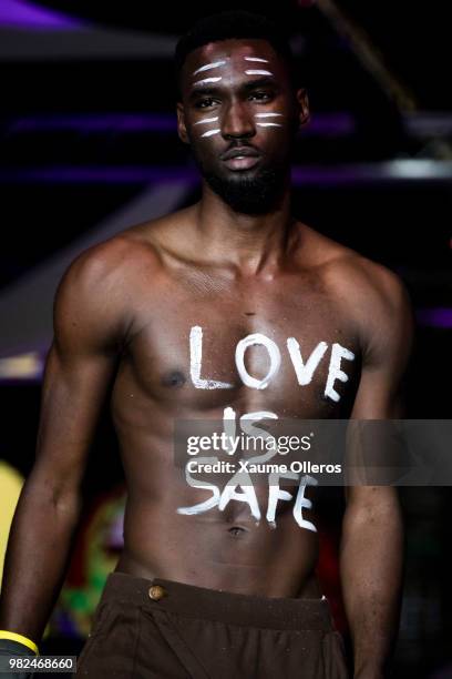 Mode walks on the runway during the Magents show of the 16th Dakar Fashion Week at Radison Blu Hotel on June 23, 2018 in Dakar, Senegal.