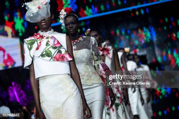 Models walk on the runway during the Thula Sindi show of the 16th Dakar Fashion Week at Radison Blu Hotel on June 23, 2018 in Dakar, Senegal.