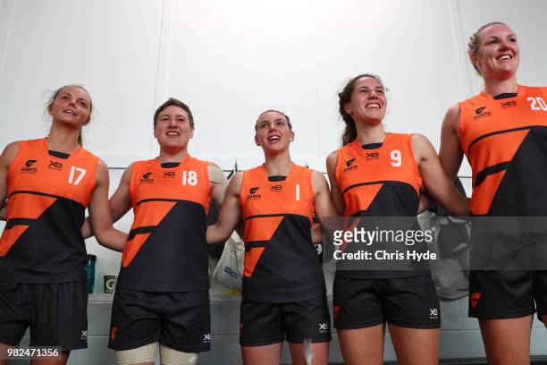 Giants sing the team song after winning the round two AFLW Winter Series match between the Gold Coast Suns and the Southern Giants at Southport on...