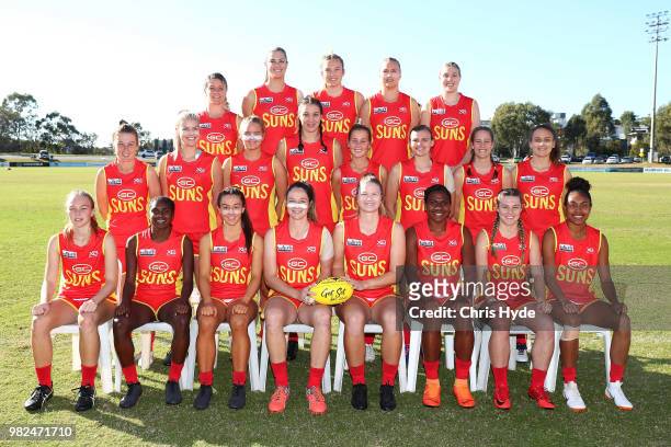 Suns pose for a team photo during the round two AFLW Winter Series match between the Gold Coast Suns and the Southern Giants at Southport on June 24,...