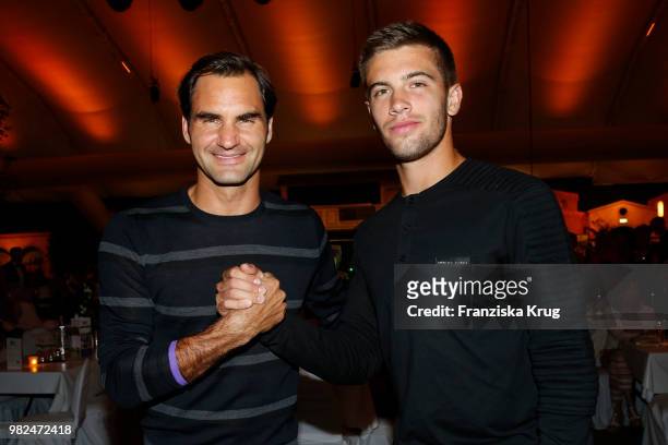 Tennis players Roger Federer and Borna Coric attend the Gerry Weber Open Fashion Night 2018 at Gerry Weber Stadium on June 23, 2018 in Halle, Germany.