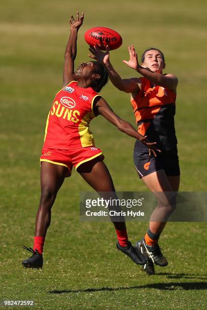 Delma Gisu of the Suns and Gabrielle Goldsworthy of the Giants compete for the ball during the round two AFLW Winter Series match between the Gold...