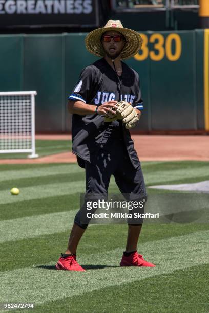 Golden State Warriors point guard Stephen Curry plays in Water For Life Charity Softball Game at Oakland-Alameda County Coliseum on June 23, 2018 in...