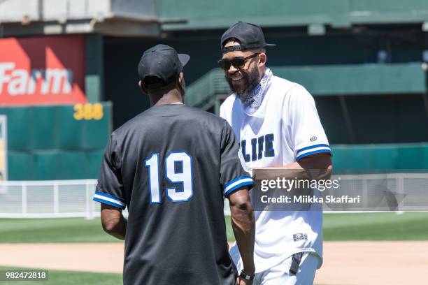 Golden State Warriors forward Andre Iguodala and center JaVale McGee play in Water For Life Charity Softball Game at Oakland-Alameda County Coliseum...