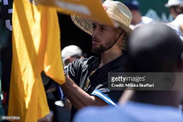 Golden State Warriors point guard Stephen Curry signs autographs at Water For Life Charity Softball Game at Oakland-Alameda County Coliseum on June...