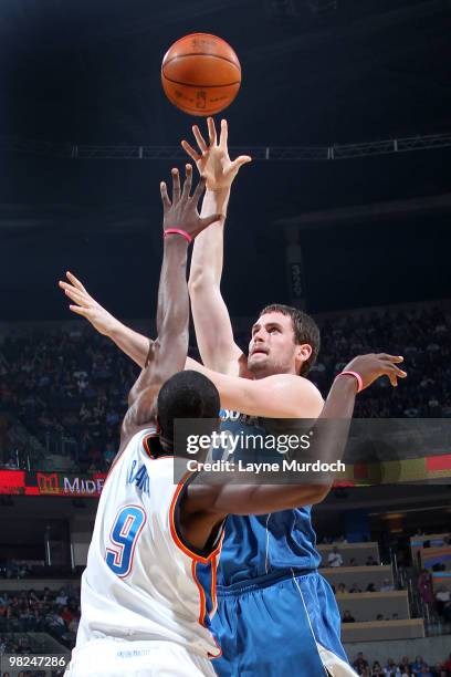 Kevin Love of the Minnesota Timberwolves shoots over Serge Ibaka of the Oklahoma City Thunder on April 4, 2010 at the Ford Center in Oklahoma City,...