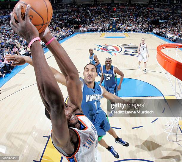 Serge Ibaka of the Oklahoma City Thunder goes up to dunk the ball on Ryan Hollins of the Minnesota Timberwolves on April 4, 2010 at the Ford Center...