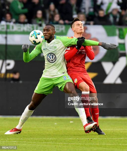 Wolfsburg's Josuha Guilavogui and Stuttgart's Erik Thommy vie for the ball during the German Bundesliga football match between VfL Wolfsburg and VfB...