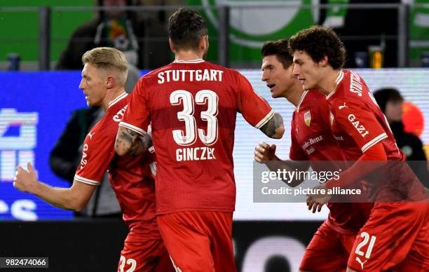 Stuttgart's Mario Gomez celebrates scoring his side's first goal with teammates Andreas Beck , Daniel Ginczek and Benjamin Pavard during the German...