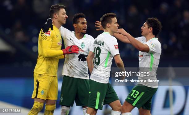 Bremen's goalie Jiri Pavlenka, Theodor Gebre Selassie, Niklas Moisander and Milos Veljkovic celebrate their 1:2 win in the German Bundesliga football...