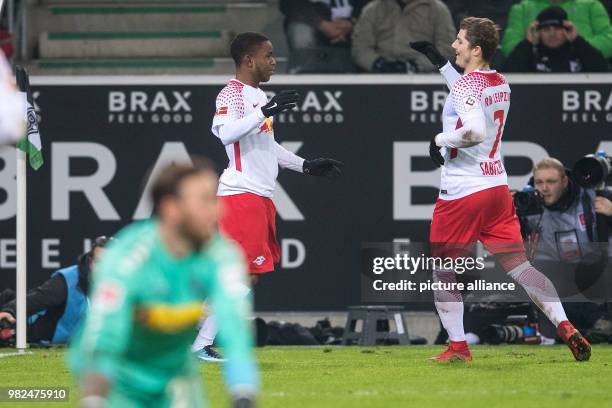 Leipzig goalscorer Ademola Lookman and Marcel Sabitzer celebrate after the goal for 1:0 during the German Bundesliga football match between Borussia...