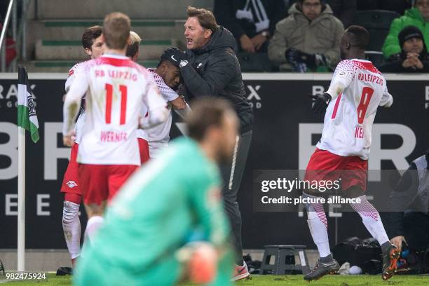 Leipzig goalscorer Ademola Lookman and coach Ralph Hasenhuettl celebrate after the goal for 1:0 during the German Bundesliga football match between...