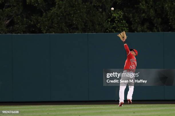 Michael Hermosillo of the Los Angeles Angels of Anaheim catches a fly ball hits a by Steve Pearce of the Toronto Blue Jays during the seventh inning...