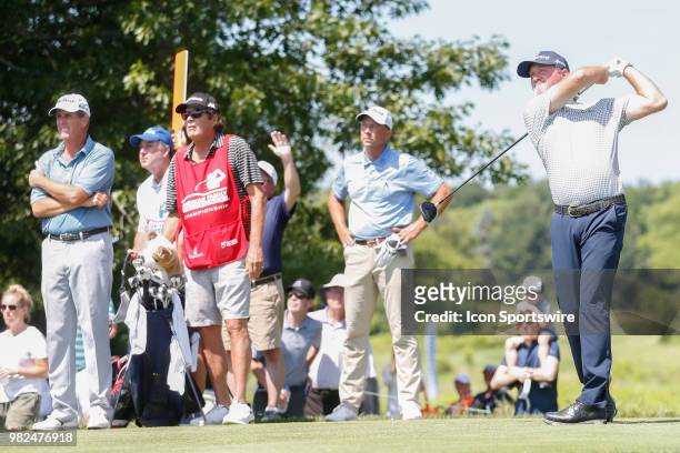 Jerry Kelly tees off on the second tee while Jerry Smith and Doug Garwood look on during the American Family Insurance Championship Champions Tour...