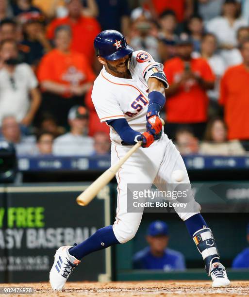 Carlos Correa of the Houston Astros hits a walkoff single in the twelfth inning against the Kansas City Royals for a 4-3 win at Minute Maid Park on...