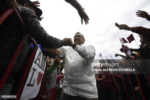 Mexico's presidential candidate for the MORENA party, Andres Manuel Lopez Obrador, greets supporters during a campaign rally in Tlaxcala, Mexico on...