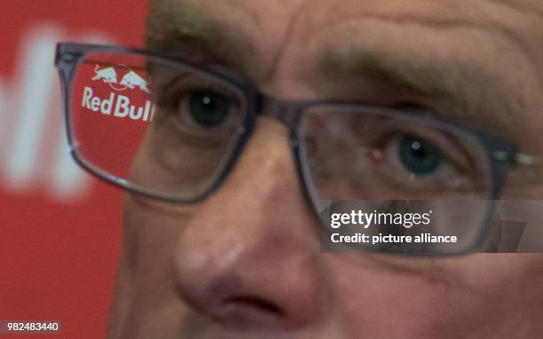 The RedBull logo is visible in the glasses of Leipzig's sports director, Ralf Rangnick, who is attending a press conference in Leipzig, Germany, 02...