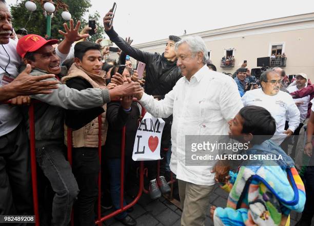 Mexico's presidential candidate for the MORENA party, Andres Manuel Lopez Obrador, greets supporters during a campaign rally in Tlaxcala, Mexico on...