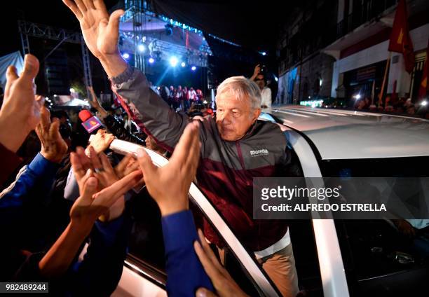 Mexico's presidential candidate for the MORENA party, Andres Manuel Lopez Obrador, greets supporters after campaign rally in Tlaxcala, Mexico on June...