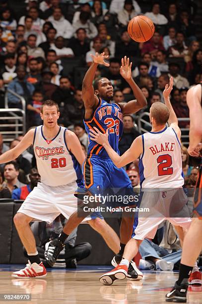 Toney Douglas of the New York Knicks passes against Steve Blake of the Los Angeles Clippers at Staples Center on April 4, 2010 in Los Angeles,...