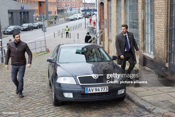 The Lebanese-Swedish actor Fares Fares and the Danish actor Nikolaj Lie Kaas pass a car at the corner of Sandberg/Grosse Elbstrasse during the...