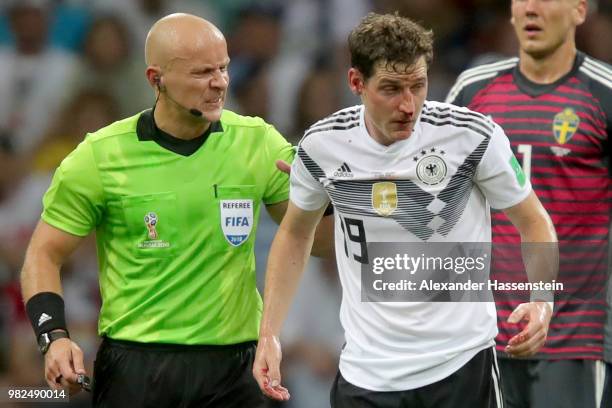 Sebastian Rudy of Germany leaves the pitch next to Szymon Marciniak following an injury during the 2018 FIFA World Cup Russia group F match between...