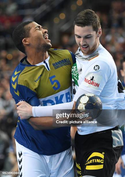 Germany's Hendrik Pekeler in action against All Star's Mads Mensah Larsen during the All Star Game 2018 handball match between the All Star Team and...