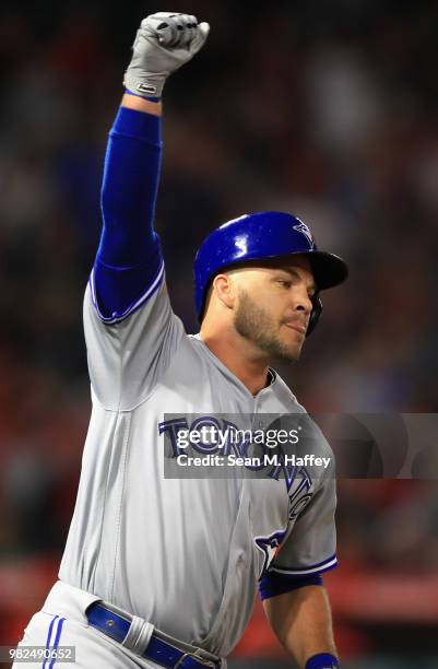 Steve Pearce of the Toronto Blue Jays reacts after hitting a three-run homerun during the ninth inning of a game against the Los Angeles Angels of...